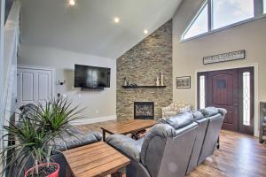 a living room with a couch and a table at Condo with Grill Walk to North Conway and Cranmore! in North Conway