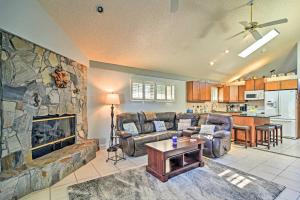 a living room with a couch and a fireplace at Sunny Seminole Home with Pool, 4 Miles to Beach! in Seminole