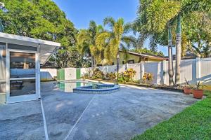 a house with a swimming pool in a yard at Sunny Seminole Home with Pool, 4 Miles to Beach! in Seminole