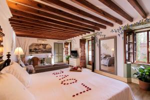Un ou plusieurs lits dans un hébergement de l'établissement Hotel Finca Ca N'ai - Adults Only