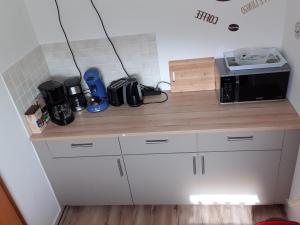 Kuchyň nebo kuchyňský kout v ubytování Gästehaus Strudthoff