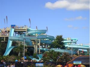 a water slide at a theme park with people on it at Coombe Lodge Holiday Flats in Paignton