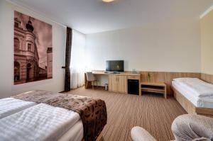 Hotel GTC 3* superior客房内的一张或多张床位