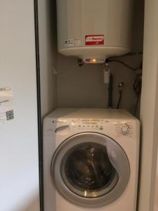 a washer and dryer in a small room at Mandana in Évian-les-Bains