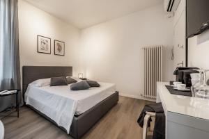 Postel nebo postele na pokoji v ubytování Emilia Suite Essence