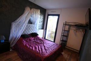 Postel nebo postele na pokoji v ubytování Hôtel Ilargi