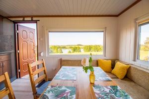 a room with a table and a couch and a window at Kingsajz in Giżycko +19 photos