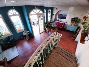 Televízia a/alebo spoločenská miestnosť v ubytovaní Hostal Costa Rica