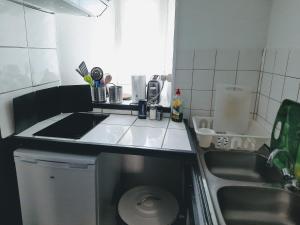 Kuchyň nebo kuchyňský kout v ubytování STUDIOS MAGUI