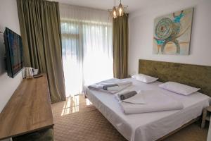 a bedroom with two beds and a large window at Annador in Jupiter