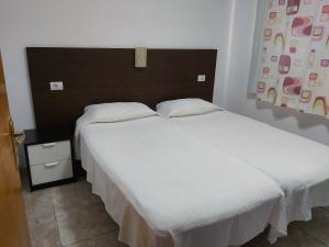 Posteľ alebo postele v izbe v ubytovaní Flipper Top Suites