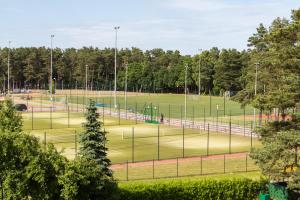 a park with a baseball field with a playground at Wypoczynek Roda in Pobierowo +101 photos