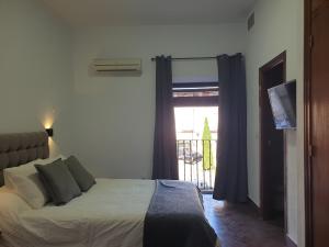 Posteľ alebo postele v izbe v ubytovaní Hostal Cuzco