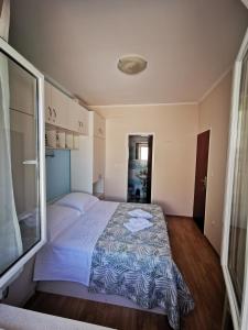 Ein Bett oder Betten in einem Zimmer der Unterkunft House Smajić