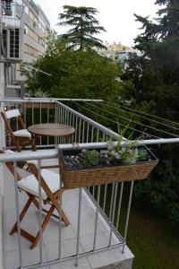 a balcony with a table and a basket of plants at Apartment Seven in Split