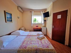 Ein Bett oder Betten in einem Zimmer der Unterkunft House Smajić