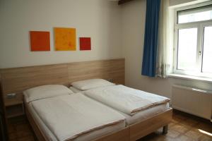 A bed or beds in a room at Apartments Wirrer