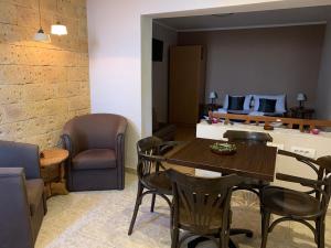 a dining room with a table and chairs at Guest Accommodation Zone in Niška Banja