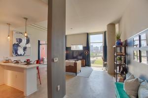 an open living room with a kitchen and a living room at Mid Century Modern Downtown Condo 30+ Night Min in Nashville