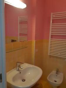 a bathroom with a sink and a mirror at RICCIO BLU pochi passi dal mare in Alba Adriatica +26 photos