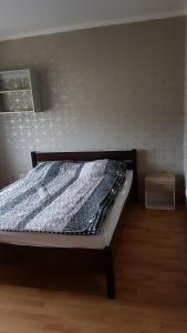 Łóżko lub łóżka w pokoju w obiekcie Nad Morzem