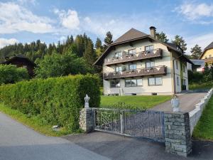 a large house with a gate in front of it at 4 Jahreszeiten in Tamsweg