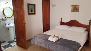 a small bedroom with a bed and a sink at VILLA TONY in Benalmádena +50 photos