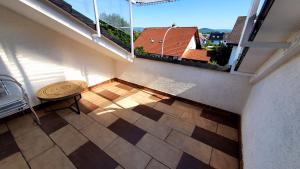 an empty balcony with a table and a window at Gründauer Monteurwohnung/Studentenwohnung in Gründau