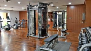a gym with several treadmills and exercise bikes at Holiday Inn Resort Phuket, an IHG Hotel - SHA Extra Plus in Patong Beach
