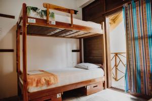 Postel nebo postele na pokoji v ubytování Esperanto Bed & Breakfast Surf Hostel