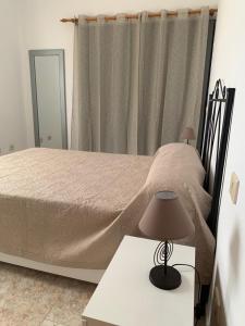 A bed or beds in a room at calle Eusebio Carballo II