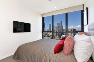 Voodi või voodid majutusasutuse Ruby Gold Coast by CLLIX toas