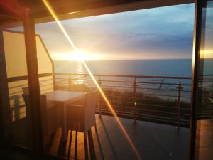 a view of the ocean from the balcony of a cruise ship at Porta Mare Apartments LuxView in Dziwnówek