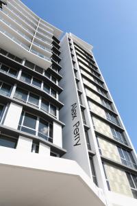 a large building with a clock on the front of it at Alex Perry Hotel & Apartments in Brisbane