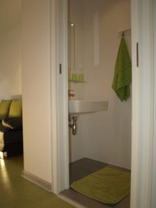 a bathroom with a sink and a mirror at Junges Hotel Annaberg in Annaberg