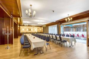 a conference room with a long table and chairs at Waldviertler-Hof in Langschlag