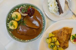 a table with a plate of food with eggs and meat at Waldviertler-Hof in Langschlag +10 photos