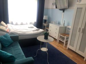 Postel nebo postele na pokoji v ubytování Willa Błękit