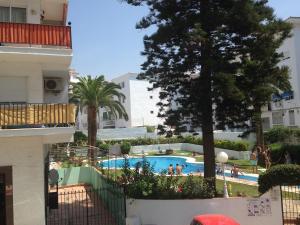 a view of a swimming pool from a building at Chez Alison! Central nerja apt in Nerja
