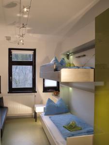 En eller flere senge i et værelse på Junges Hotel Annaberg