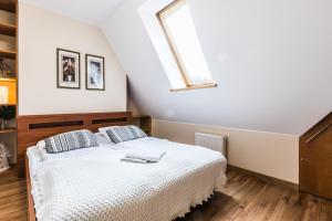 Posteľ alebo postele v izbe v ubytovaní Apartamenty Stroma Odkryj Zakopane