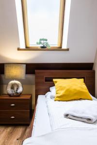 Posteľ alebo postele v izbe v ubytovaní Apartamenty Stroma Odkryj Zakopane