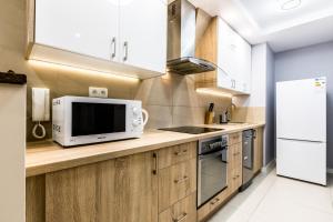 Kuchyňa alebo kuchynka v ubytovaní Apartamenty Stroma Odkryj Zakopane