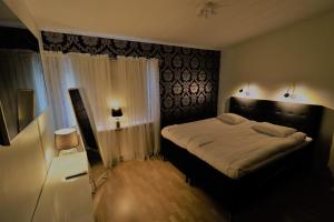 A bed or beds in a room at RIBO Apartment Aurora