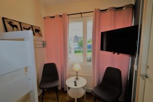 TV a/nebo společenská místnost v ubytování RIBO Apartment Aurora