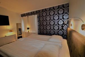 Postel nebo postele na pokoji v ubytování RIBO Apartment Aurora