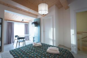 Posteľ alebo postele v izbe v ubytovaní Via Siena 4 - Suites & Rooms