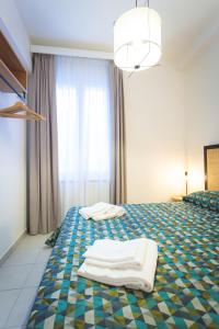 Posteľ alebo postele v izbe v ubytovaní Via Siena 4 - Suites & Rooms