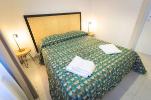 Posteľ alebo postele v izbe v ubytovaní Via Siena 4 - Suites & Rooms