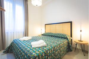 Posteľ alebo postele v izbe v ubytovaní Via Siena 4 - Suites & Rooms
